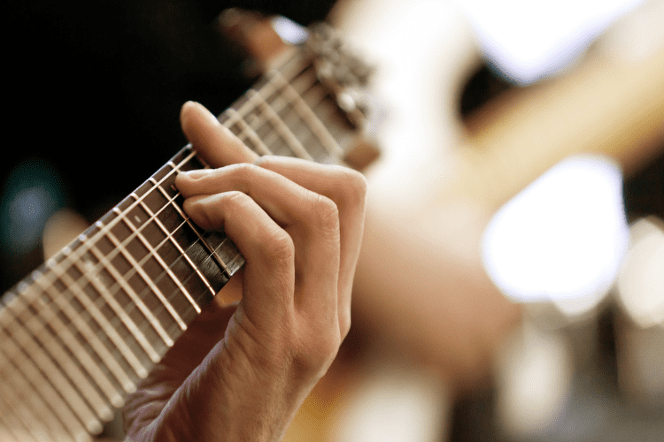 hand playing guitar