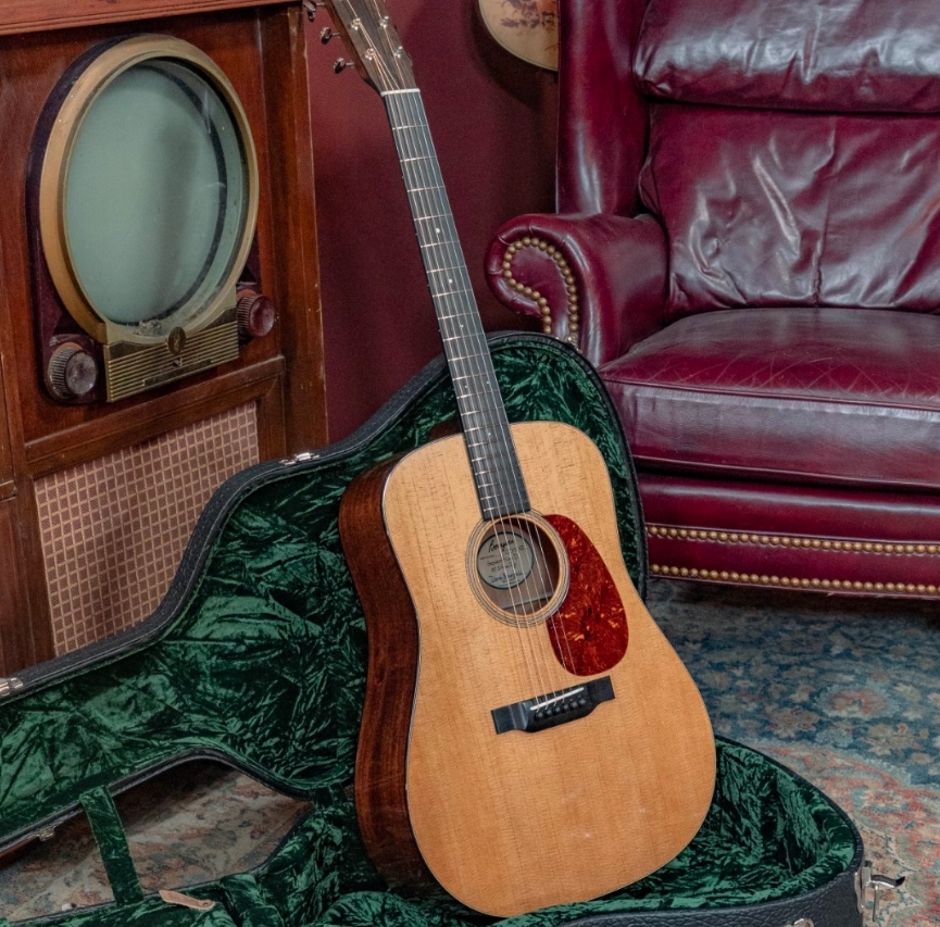 Torrefied Cedar Guitar on a couch